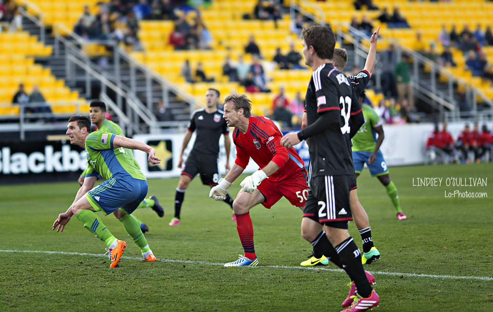 Seattle Sounders forward chasing the ball during a preseason match.