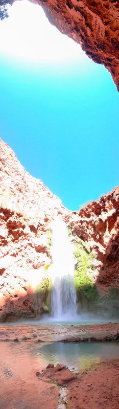 Chains and ladders leading hikers down the cliffside at Mooney Falls