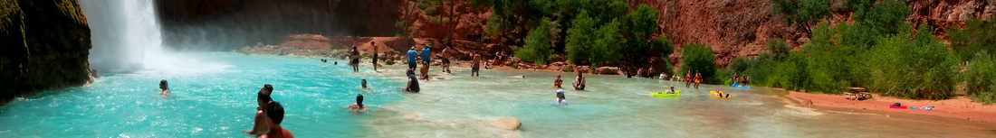 Chains and ladders leading hikers down the cliffside at Mooney Falls