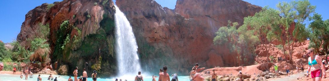 Group of friends hiking the canyon trail toward Havasu Falls