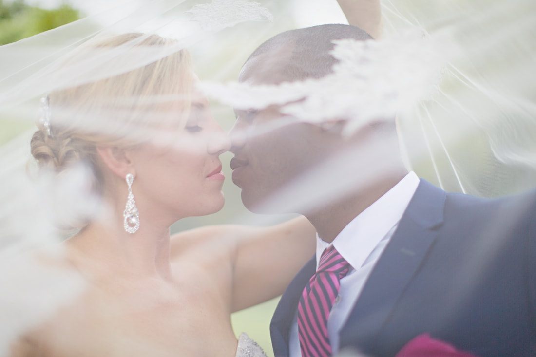 Sara and Dwayne on their Charleston, SC wedding day surrounded by historic architecture.