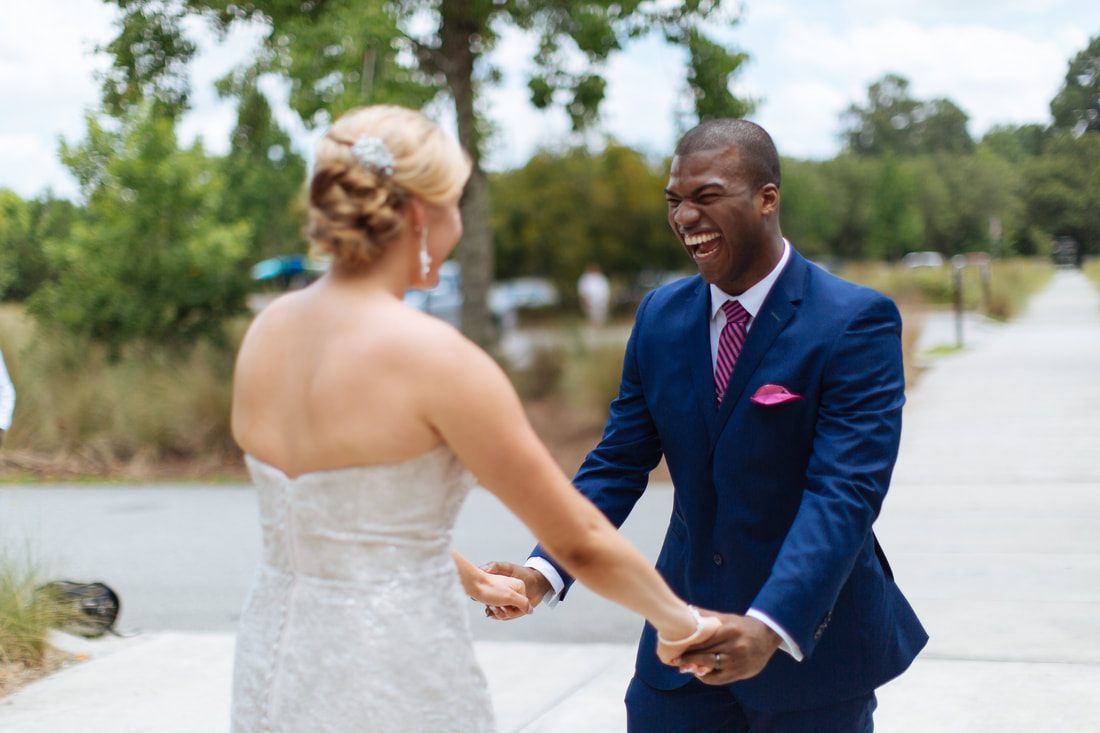 Sara and Dwayne sharing a candid moment on their Charleston wedding day.
