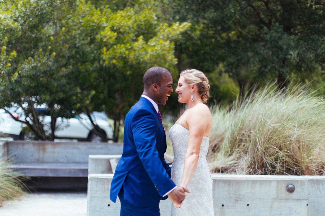 Sara and Dwayne posing together during their Charleston wedding photo session.