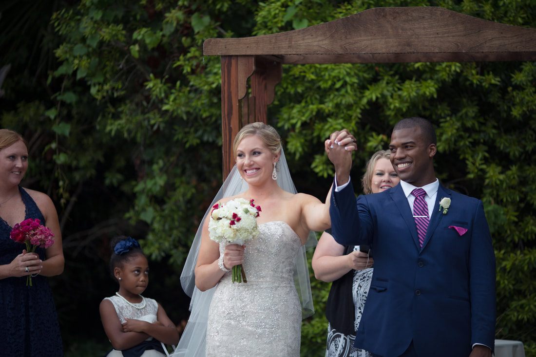 Joyful reception moment captured at Sara and Dwayne's Charleston wedding.
