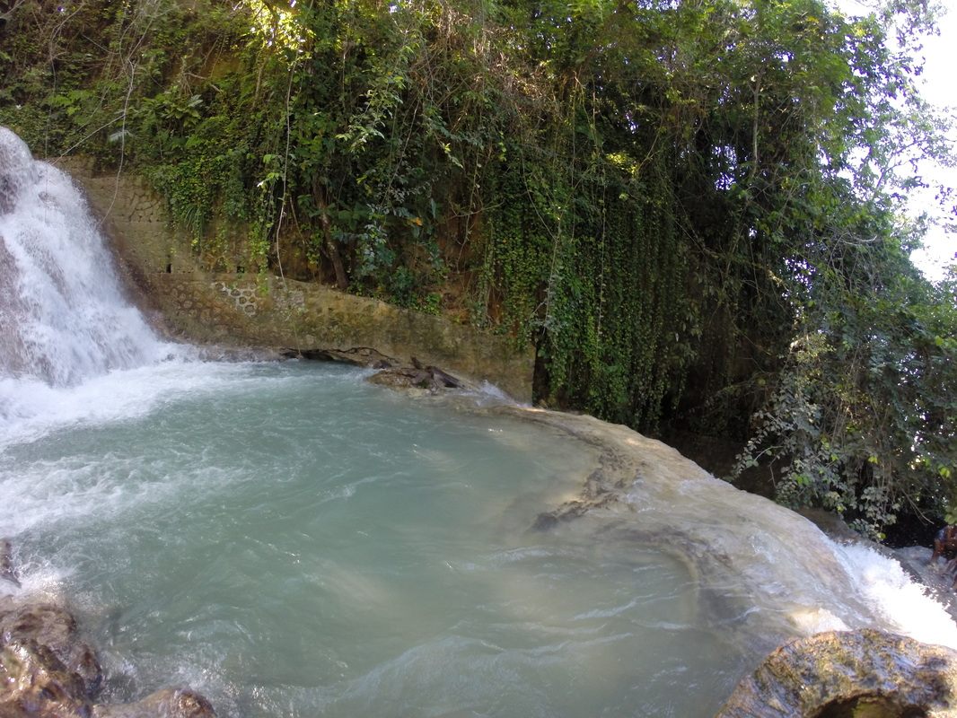 Hikers climbing the terraced rock of Dunn River Falls in Ocho Rios