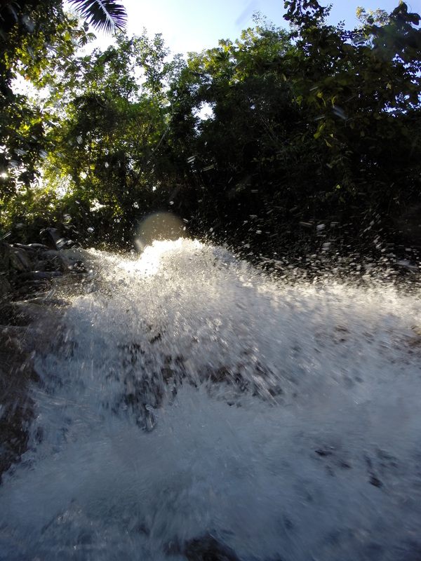 Hikers climbing the terraced rock of Dunn River Falls in Ocho Rios