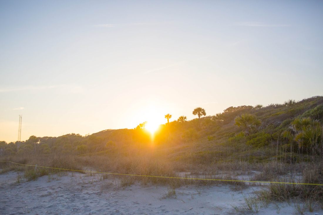 Photo of a campfire on the beach at night in Edisto Island, South Carolina