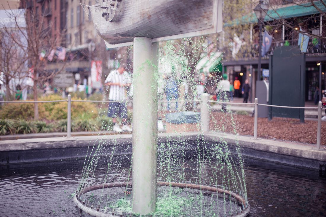 Crowds celebrating St. Patrick's Day in one of Savannah's historic downtown squares
