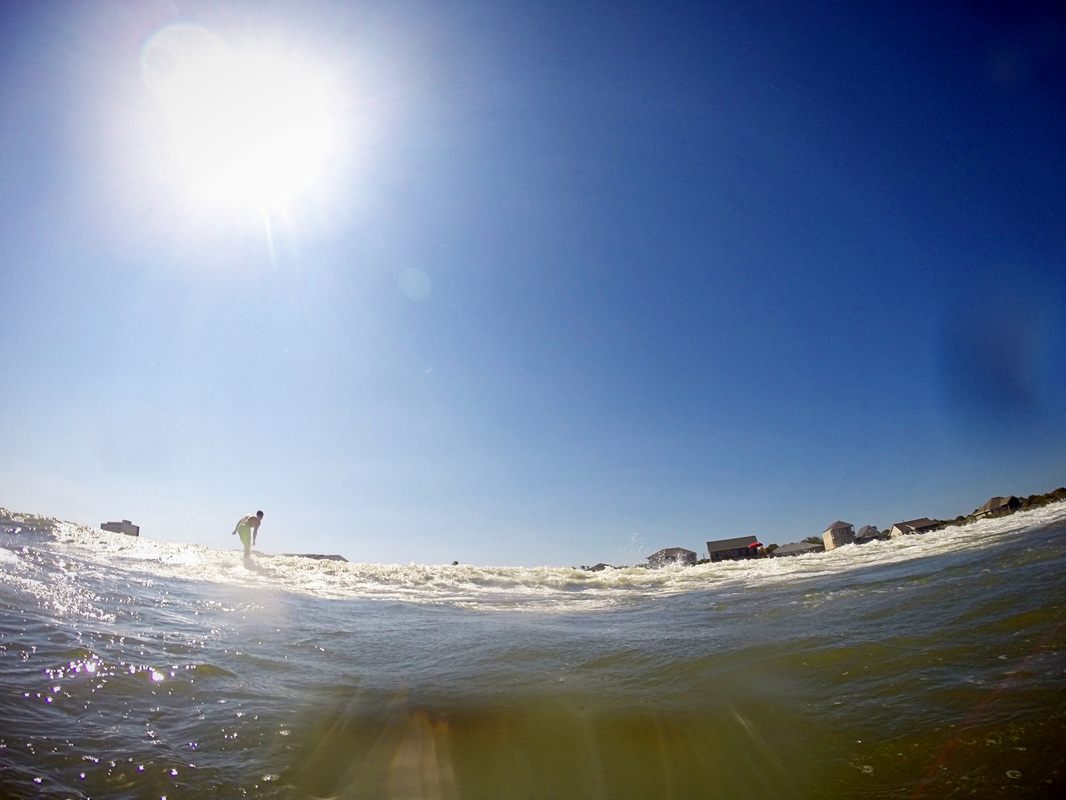 GoPro shot of a surfer catching a wave at Folly Beach, Charleston, SC