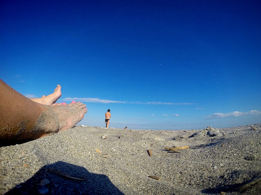 A surfer paddling out at Folly Beach, shot with a GoPro Hero 3+