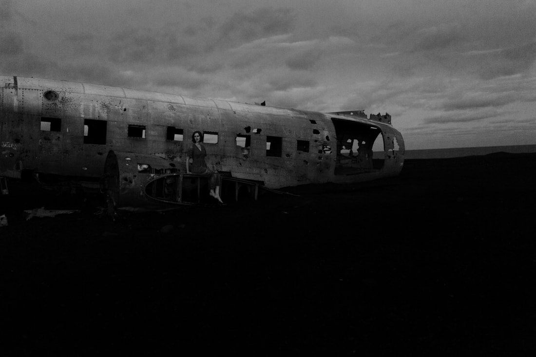 Lindsay posed inside the fuselage of the abandoned plane wreck in Iceland