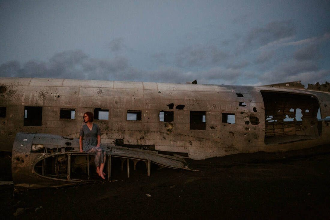 Portrait of Lindsay walking near the wreckage during the midnight session