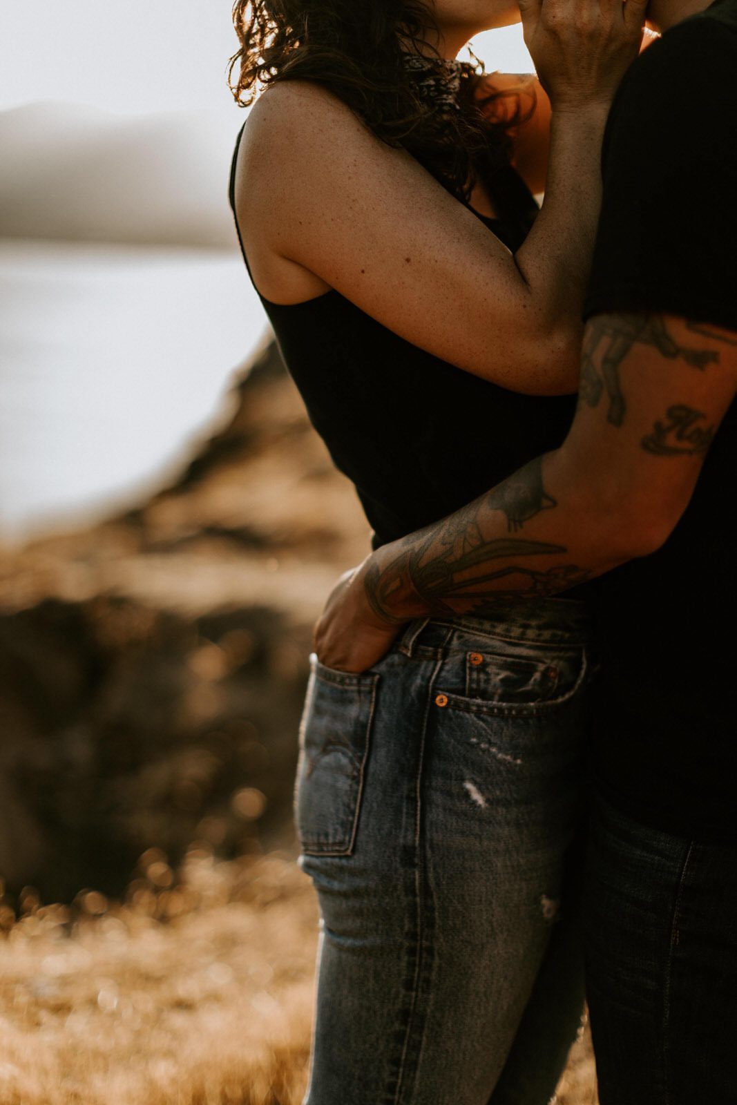 Candid portrait of the couple laughing together outdoors