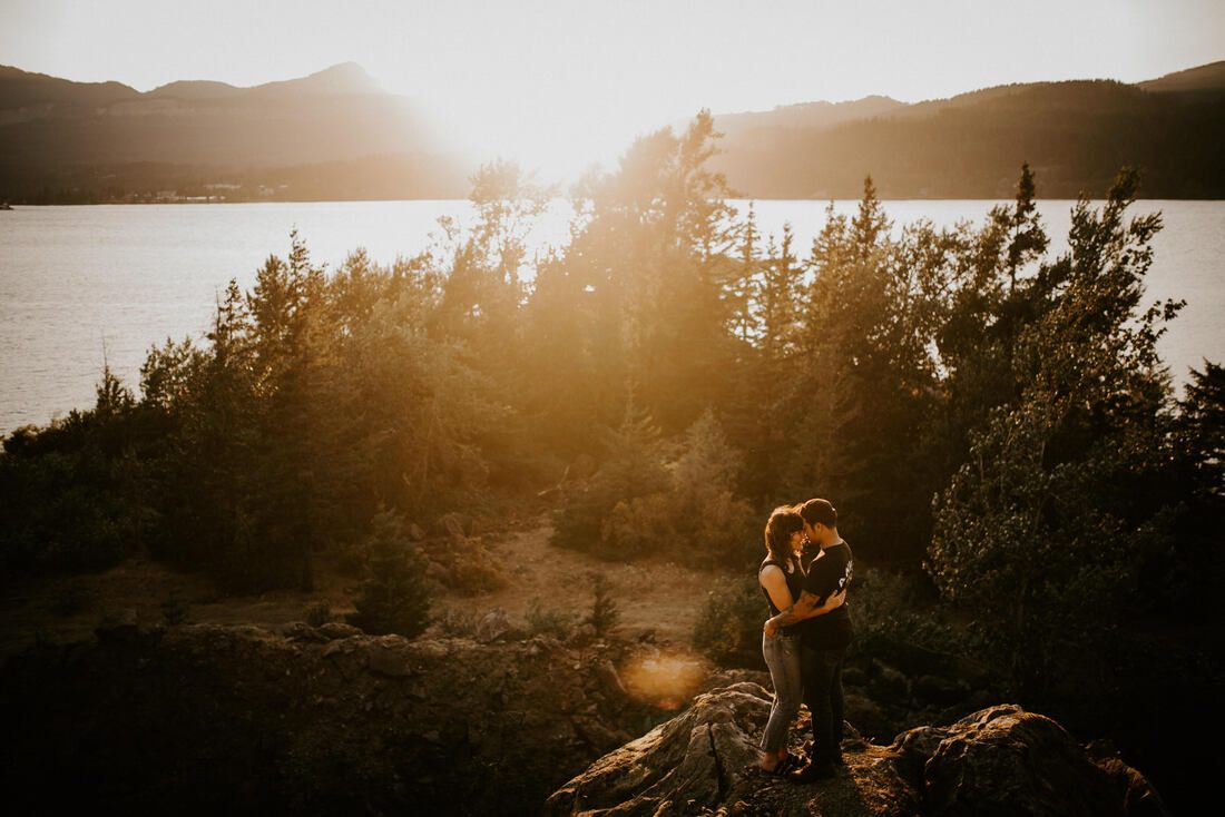 Portrait of the couple among the alpine trees near Portland, Oregon, later in the golden hour session
