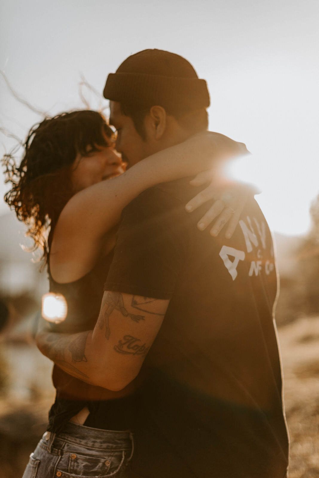 The couple standing together with Mt. Hood in the background at sunset, later in the golden hour session