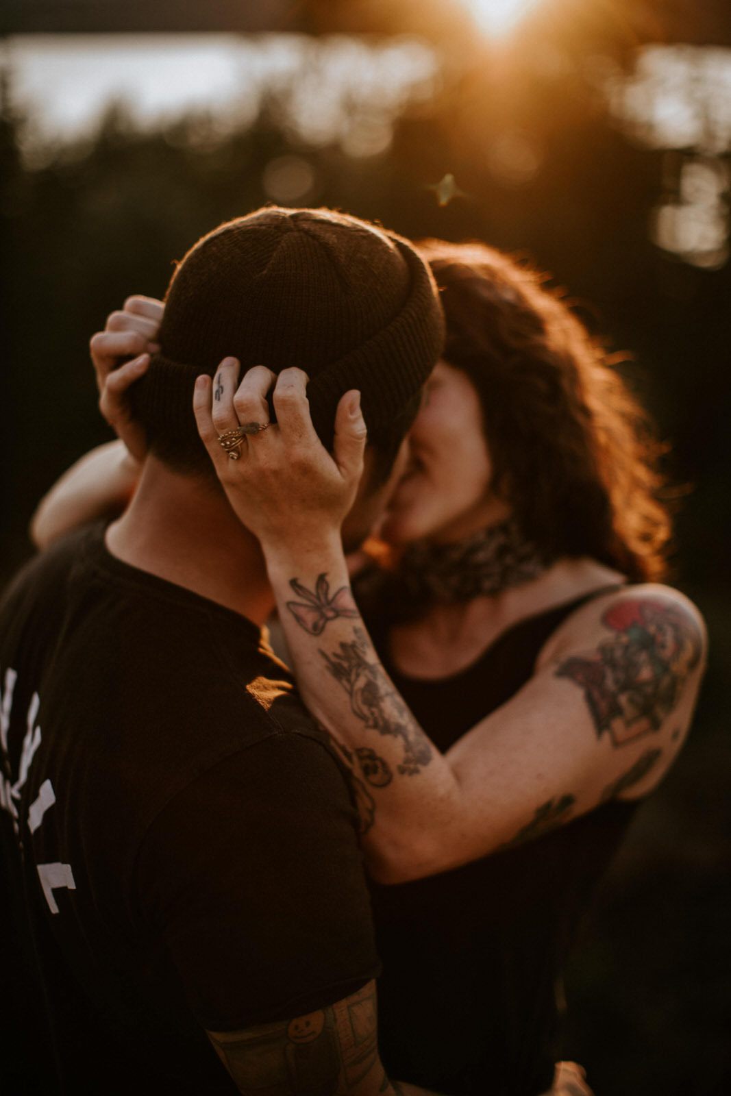 The couple embracing as the sun sets behind Mt. Hood, later in the golden hour session