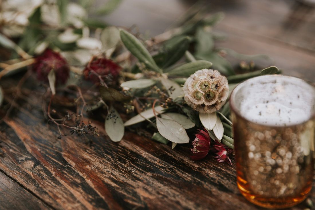Detail shot of the embroidered handkerchief carried by the bride during her orchard wedding.