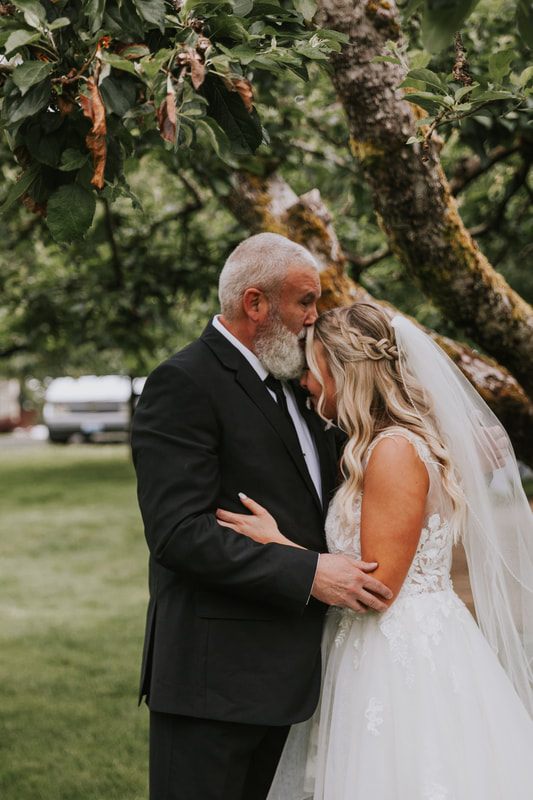 Bride and groom's first dance at their orchard wedding reception in Chehalis, Washington.