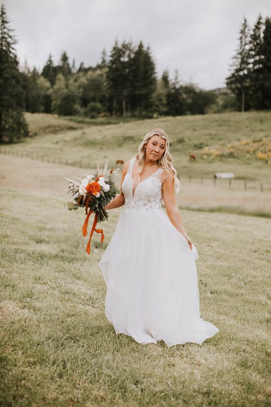 Bride and groom's first dance at their orchard wedding reception in Chehalis, Washington.