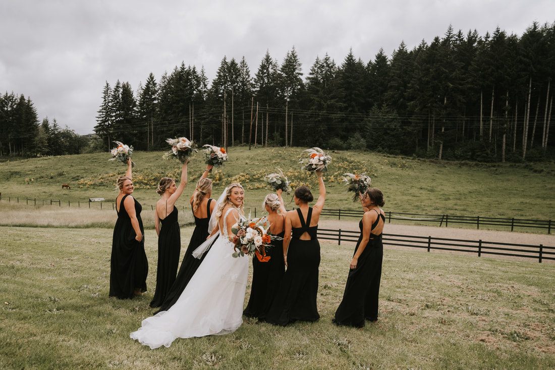 Bride walking down the aisle at a cherry orchard wedding ceremony in Chehalis, Washington.