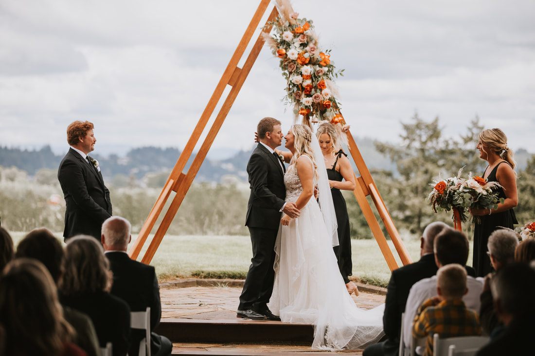 Candid moment of laughter between the bride and groom during their Chehalis wedding.