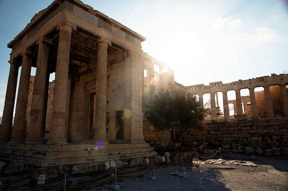 Detail of ancient Greek columns and carved marble in Athens