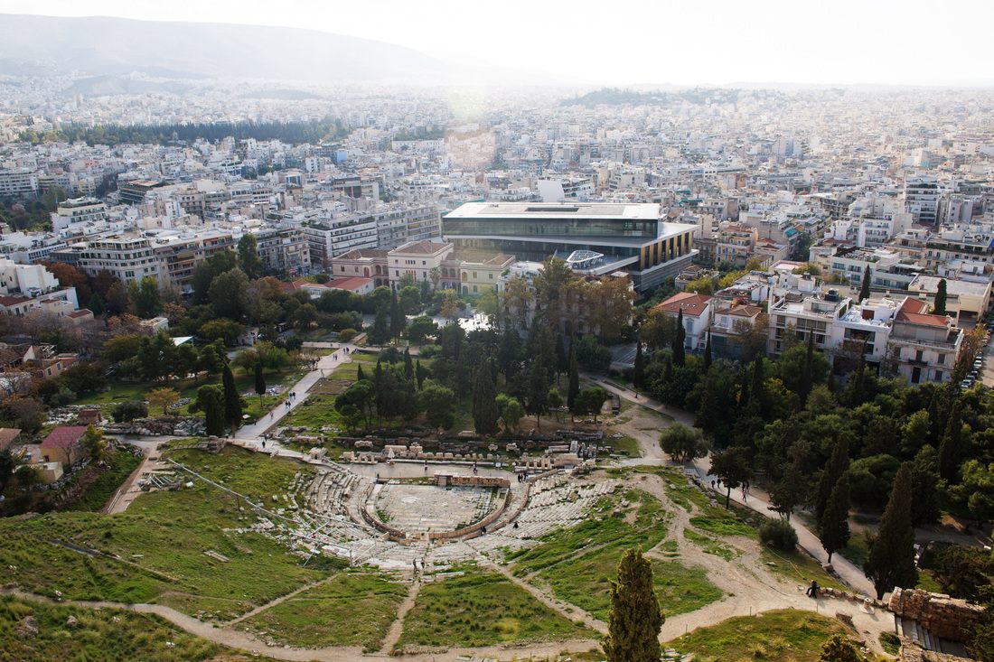 Marble fragments and column bases scattered across the Acropolis