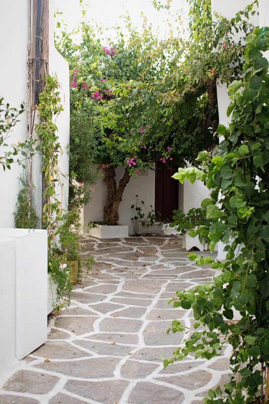 Traditional Cycladic architecture with blue-shuttered windows in Paros