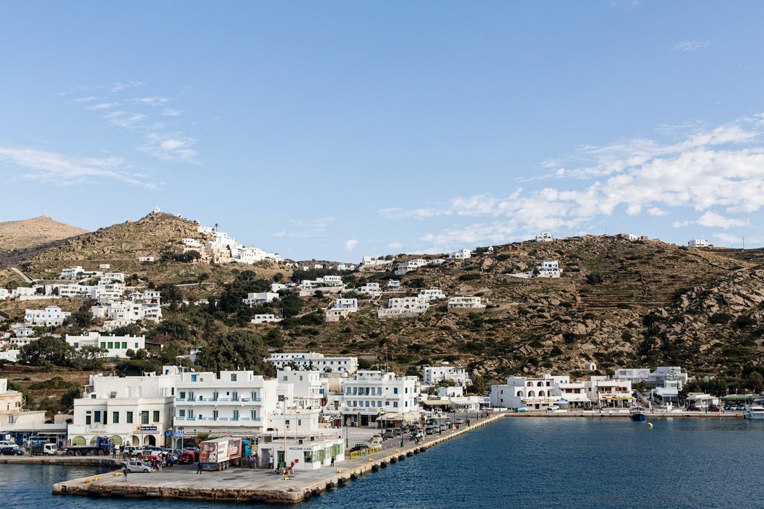 Narrow winding streets lined with white buildings in Santorini, Greece