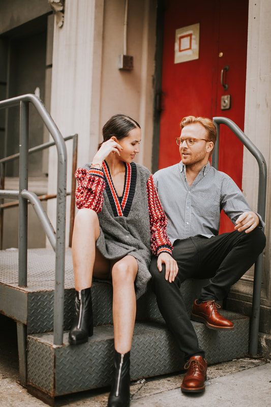 Karina laughing as Matt whispers something during their engagement session