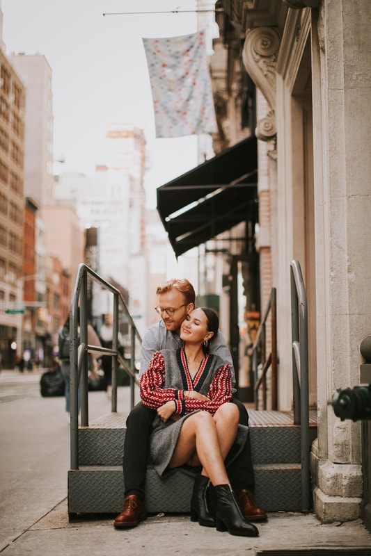 Karina and Matt laughing together near a Flatiron District storefront