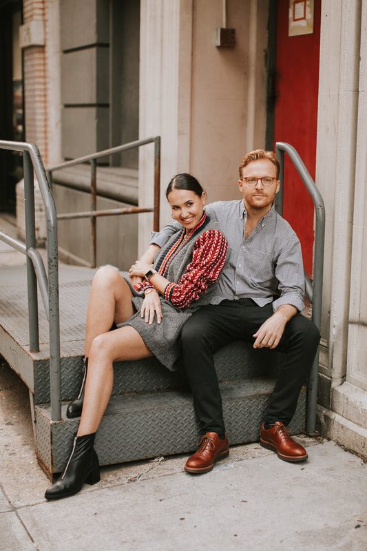Couple posing against an urban backdrop during their NYC engagement session