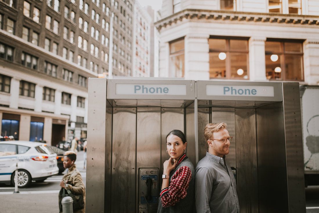 Engagement portrait with warm evening light on a New York street