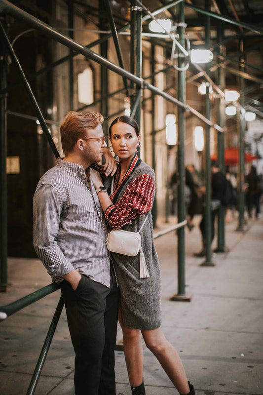 Karina and Matt laughing together under NYC streetlights