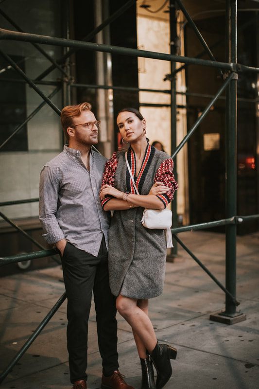 Couple walking together through Manhattan as their engagement session wraps up