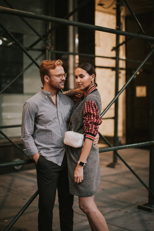 Candid portrait of the couple laughing together under the city lights