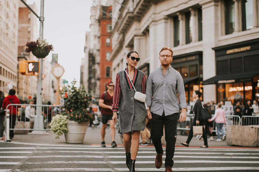 Engagement portrait with New York City's iconic architecture in the background