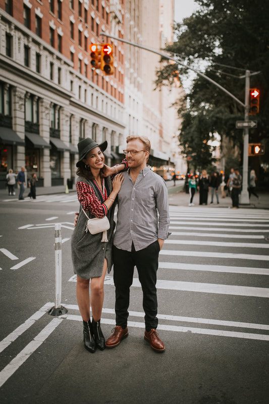 Couple posing near a classic New York City doorway