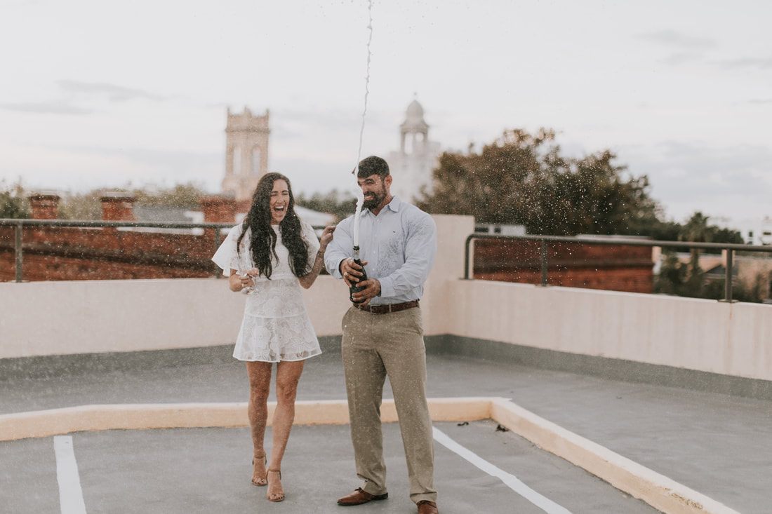 The family pausing for a candid portrait amid hanging vines downtown