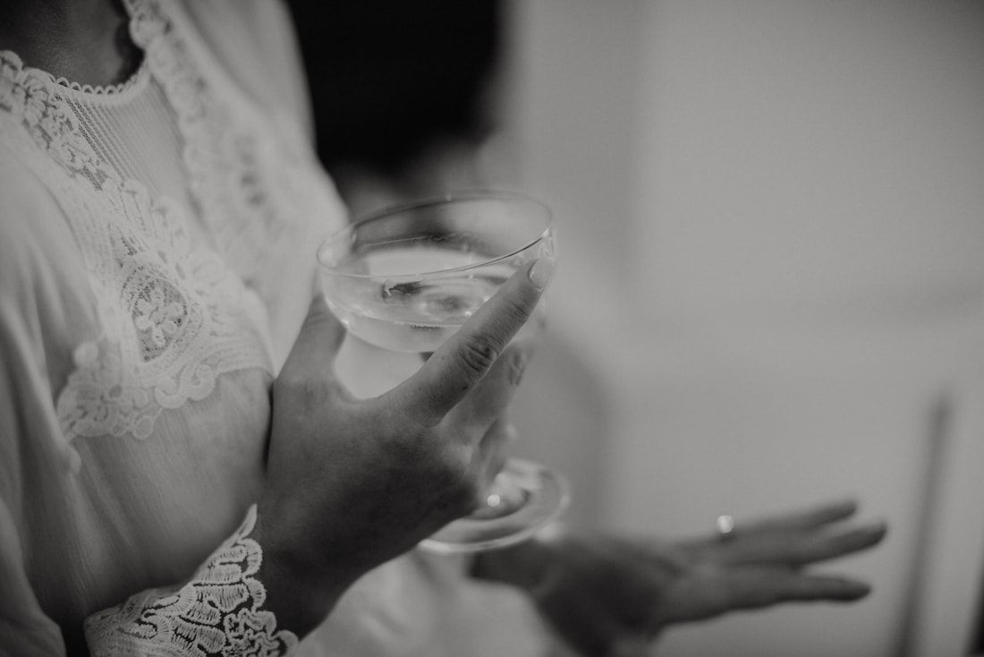 The couple exchanging vows during their ceremony at the Historic Rice Mill