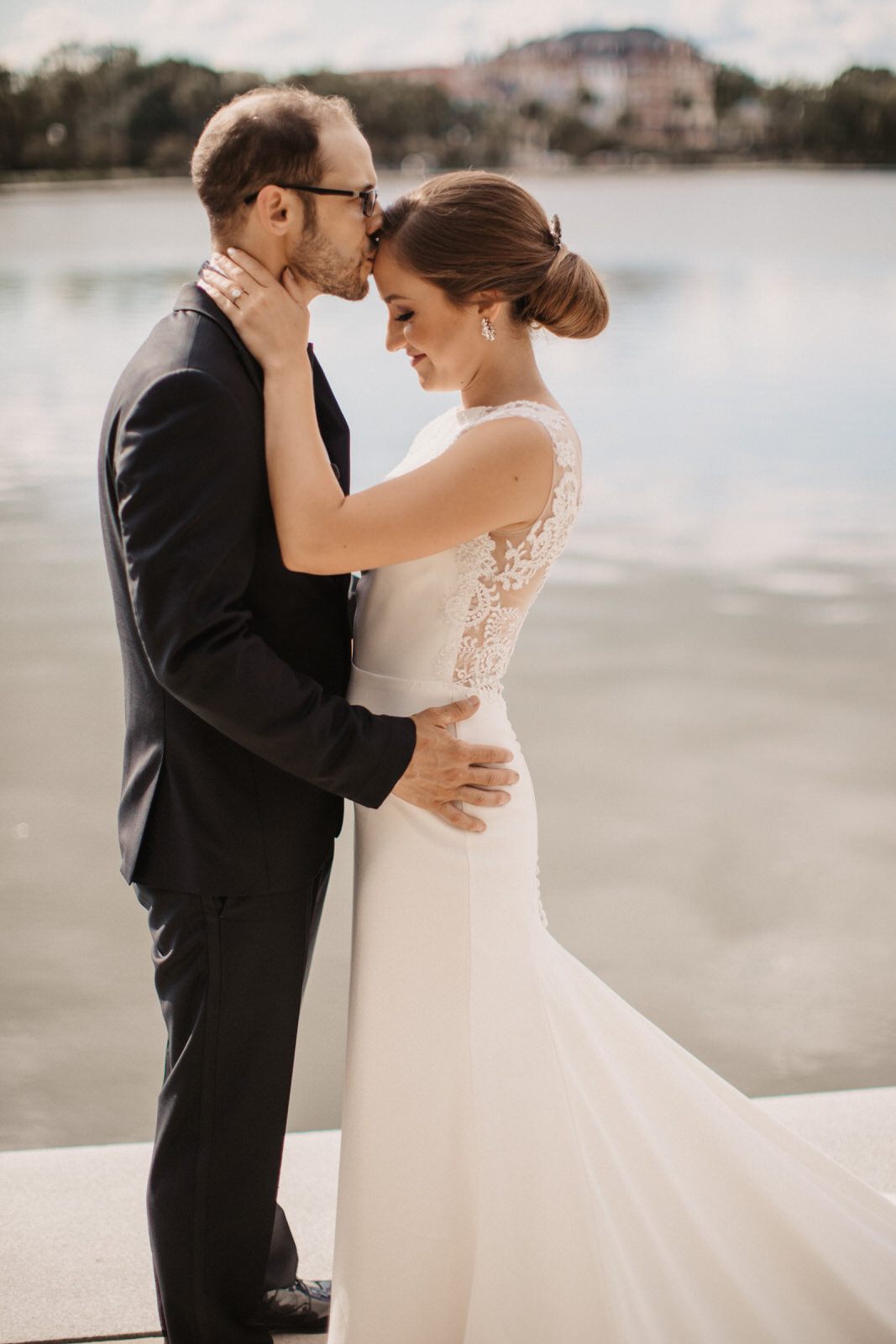 The couple exchanging vows during their ceremony at the Historic Rice Mill, another angle