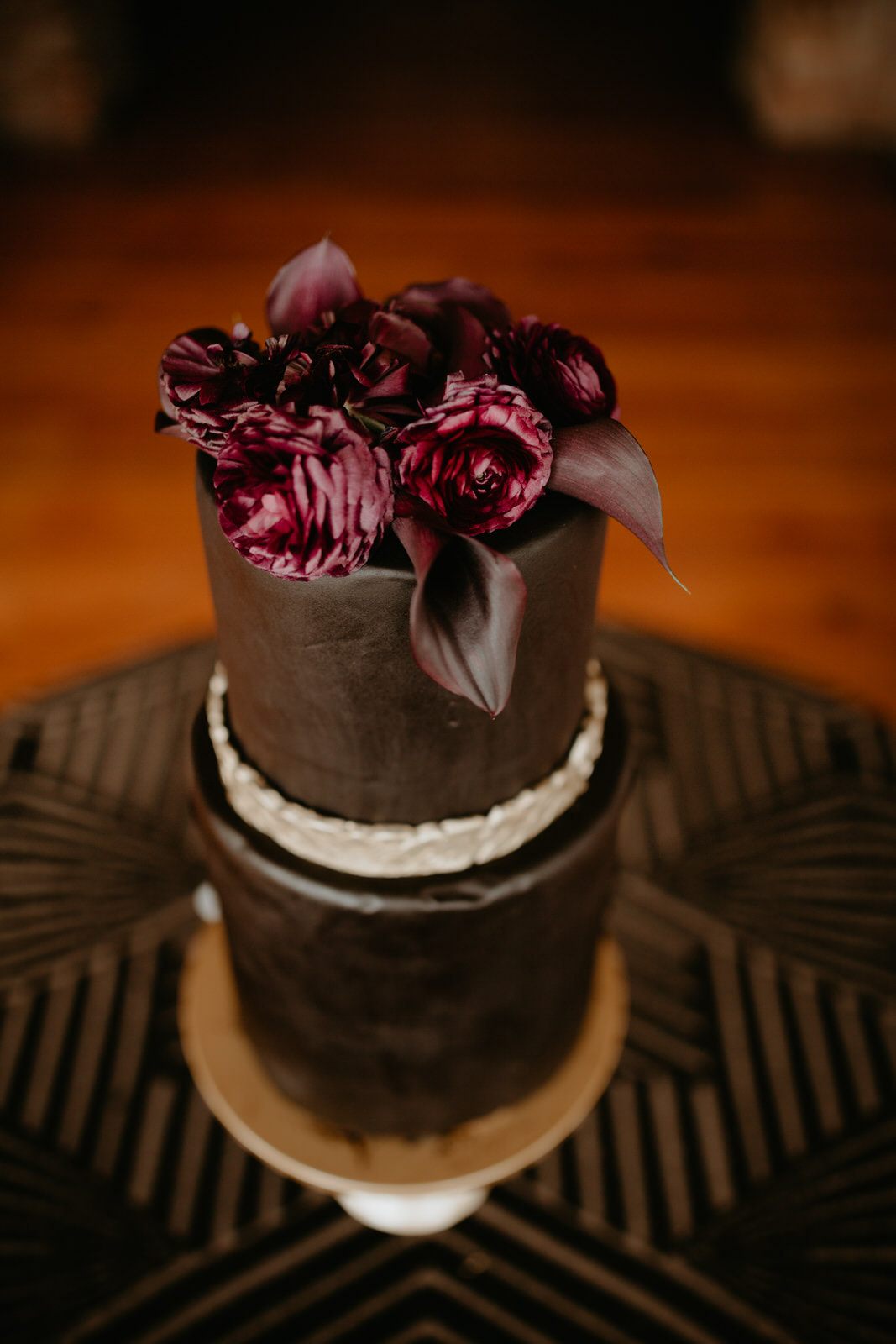Another wide shot of the reception tablescape with vintage and black floral details