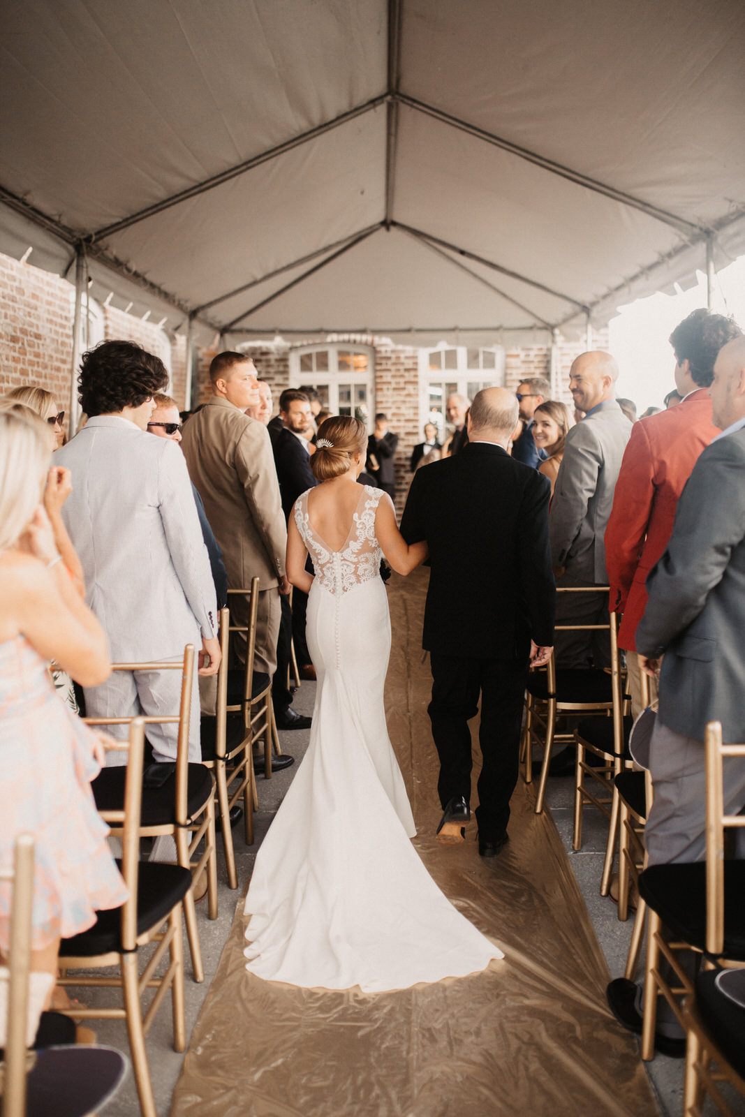 The bride and groom strolling through the historic venue grounds