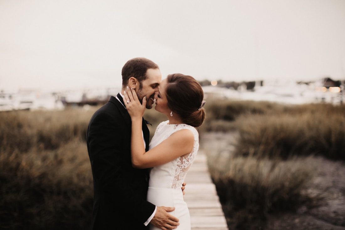 The newlyweds laughing together during their golden hour portraits