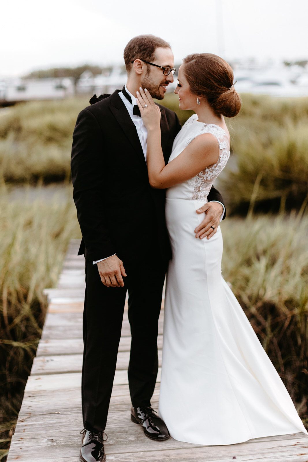 The black wedding cake displayed with vintage styling accents