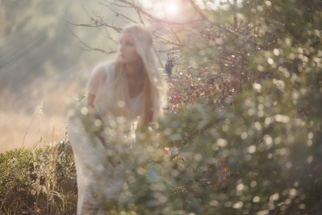 Self-portrait from a woods-set series exploring a quiet journey into the unknown