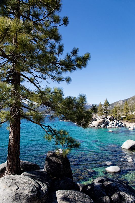 Alpine scenery surrounding Lake Tahoe's clear water
