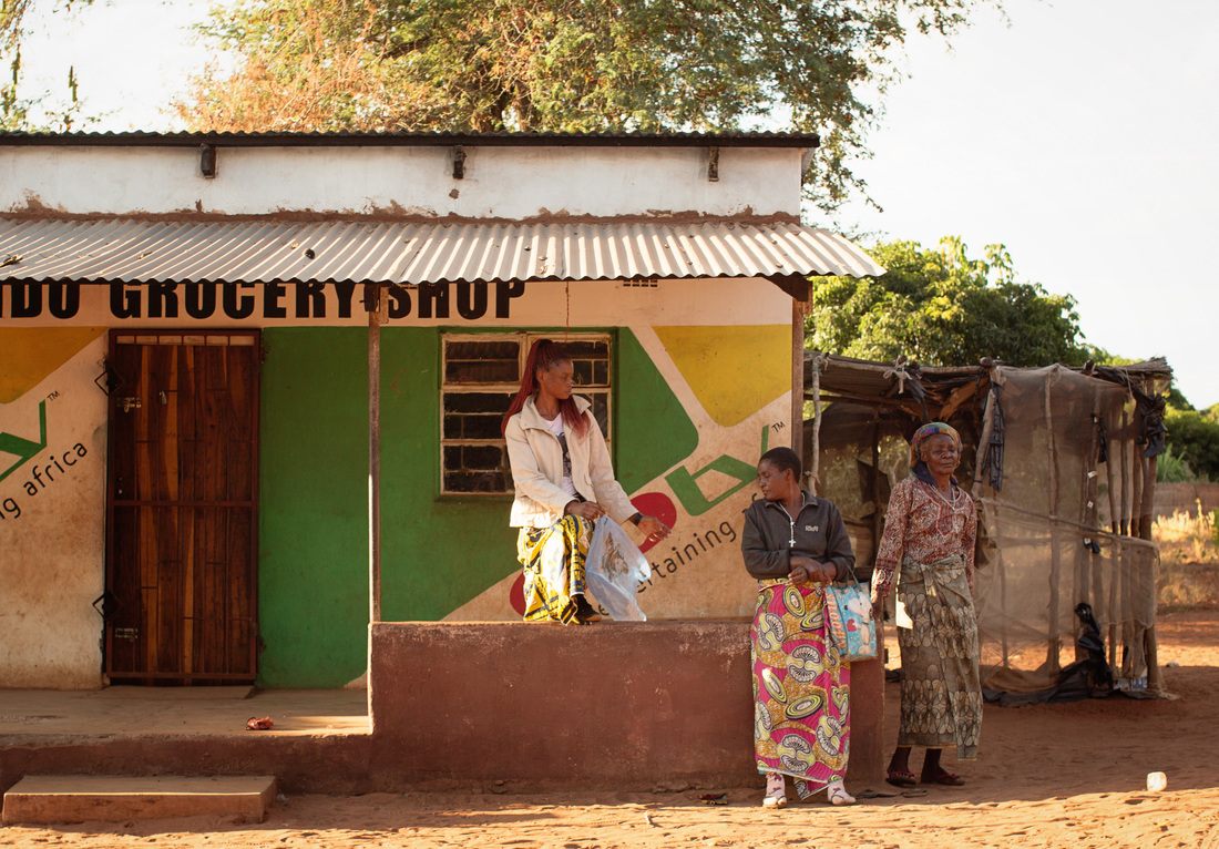 Children playing near the huts of Chief Mukuni Village
