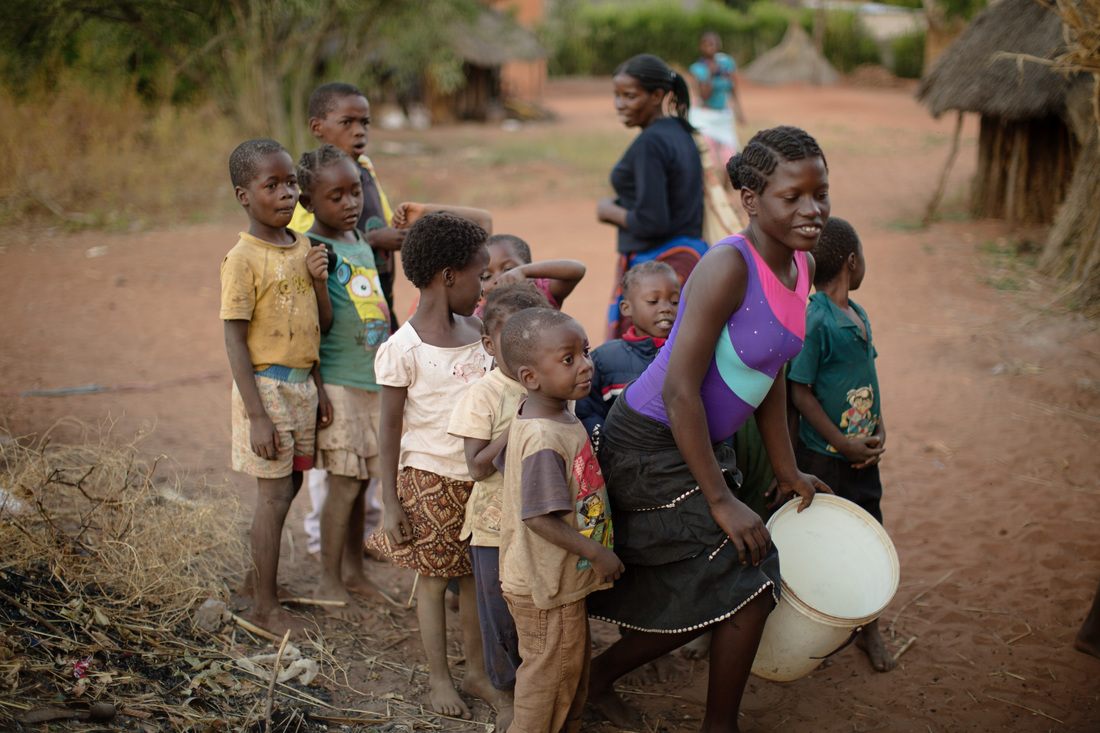 Village children posing together in Chief Mukuni Village, Zambia