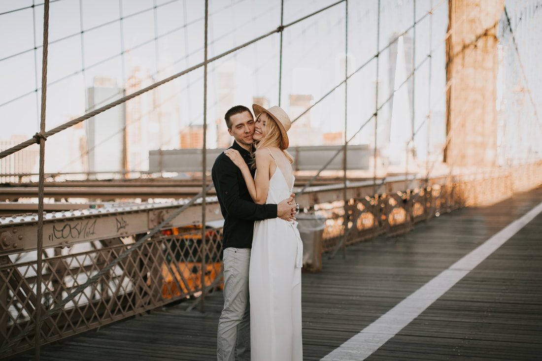 Valentina and Alex sharing a quiet moment against a Brooklyn brick wall